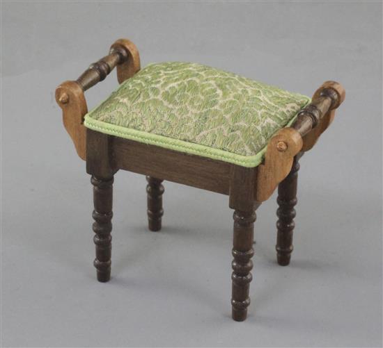 Denis Hillman. A Victorian style miniature piano stool, width 2in.